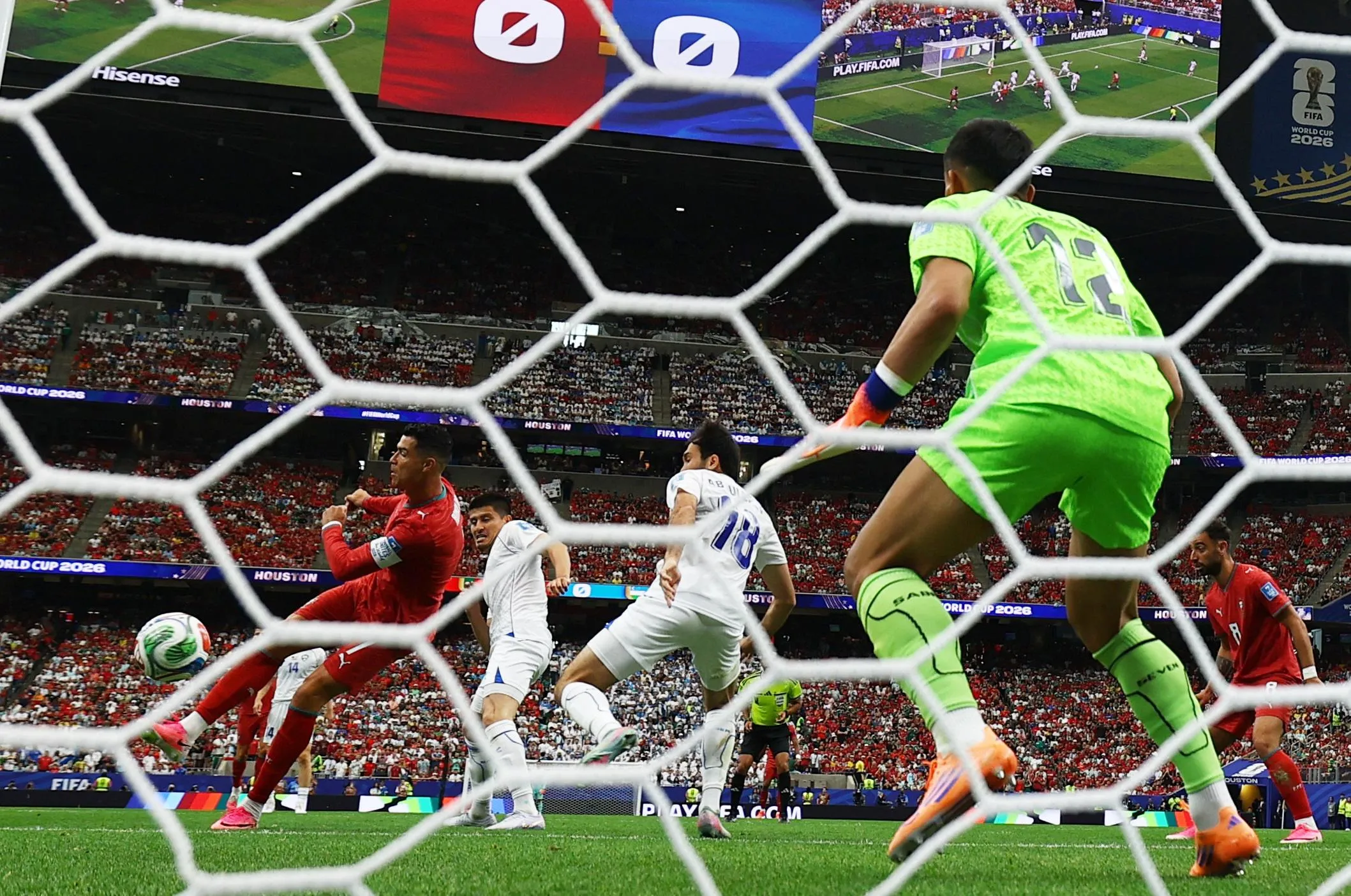 Portugal's Cristiano Ronaldo fires home with his right foot to open the scoring.
