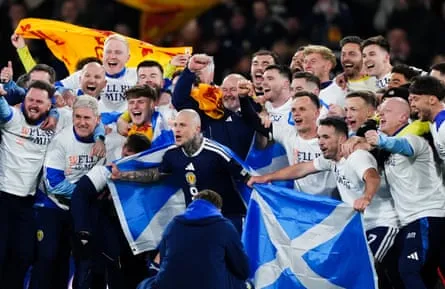Scotland players and manager Steve Clarke celebrate after they qualified for the 2026 World Cup after beating Denmark 4-2 Scotland players and manager Steve Clarke celebrate after they qualified for the 2026 World Cup after beating Denmark 4-2