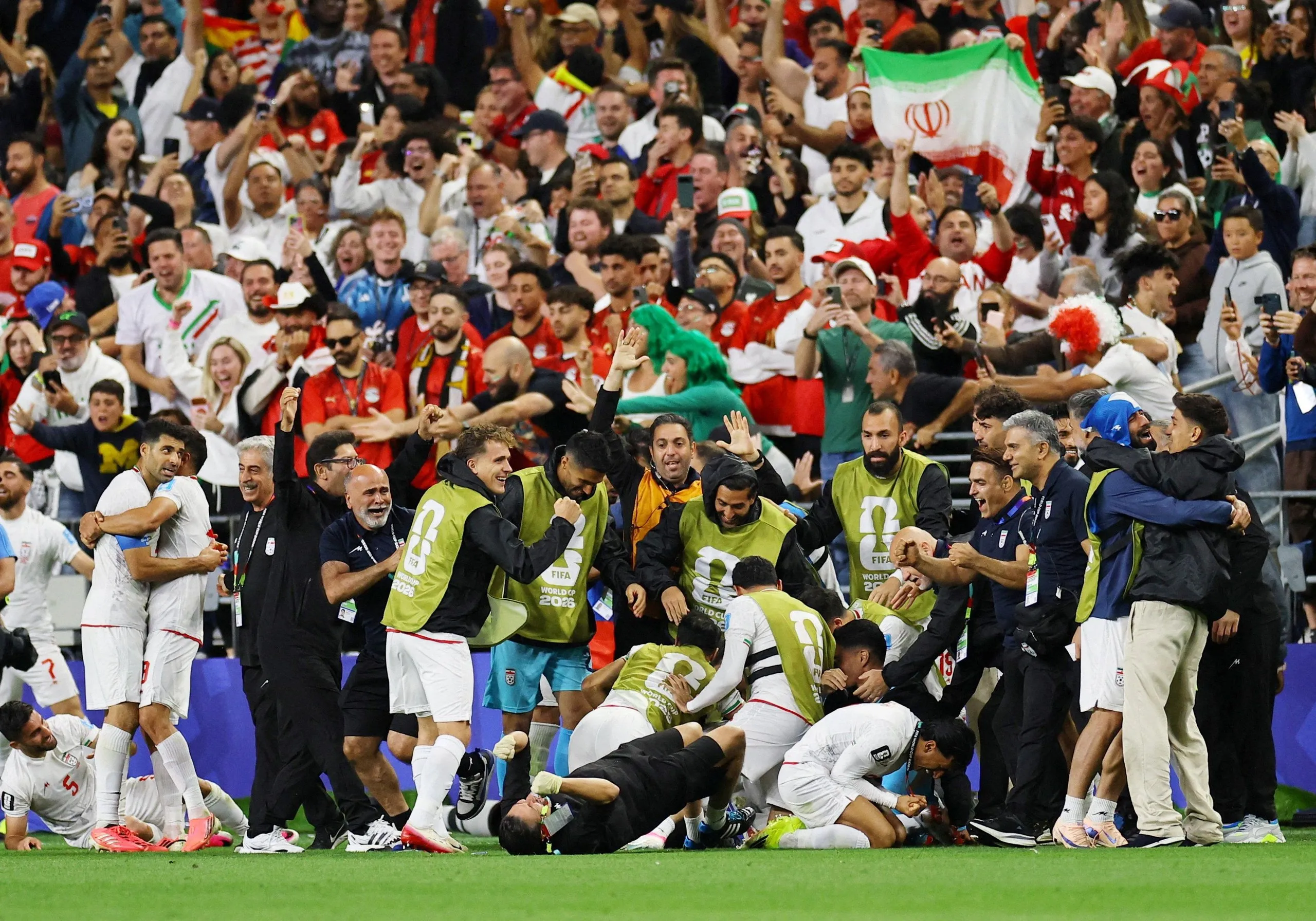 Iran players celebrate after a goal that was later disallowed.