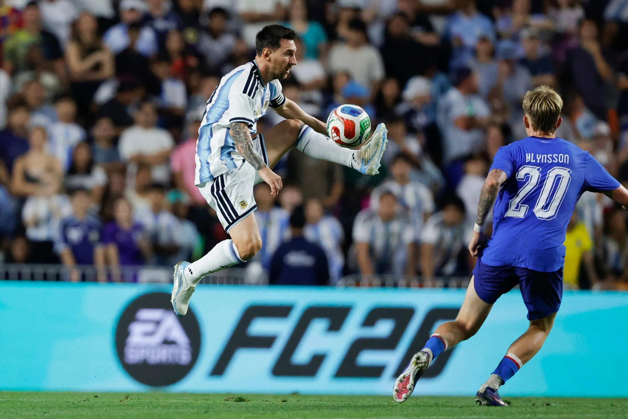 Lionel Messi brings the ball down in a friendly against Iceland