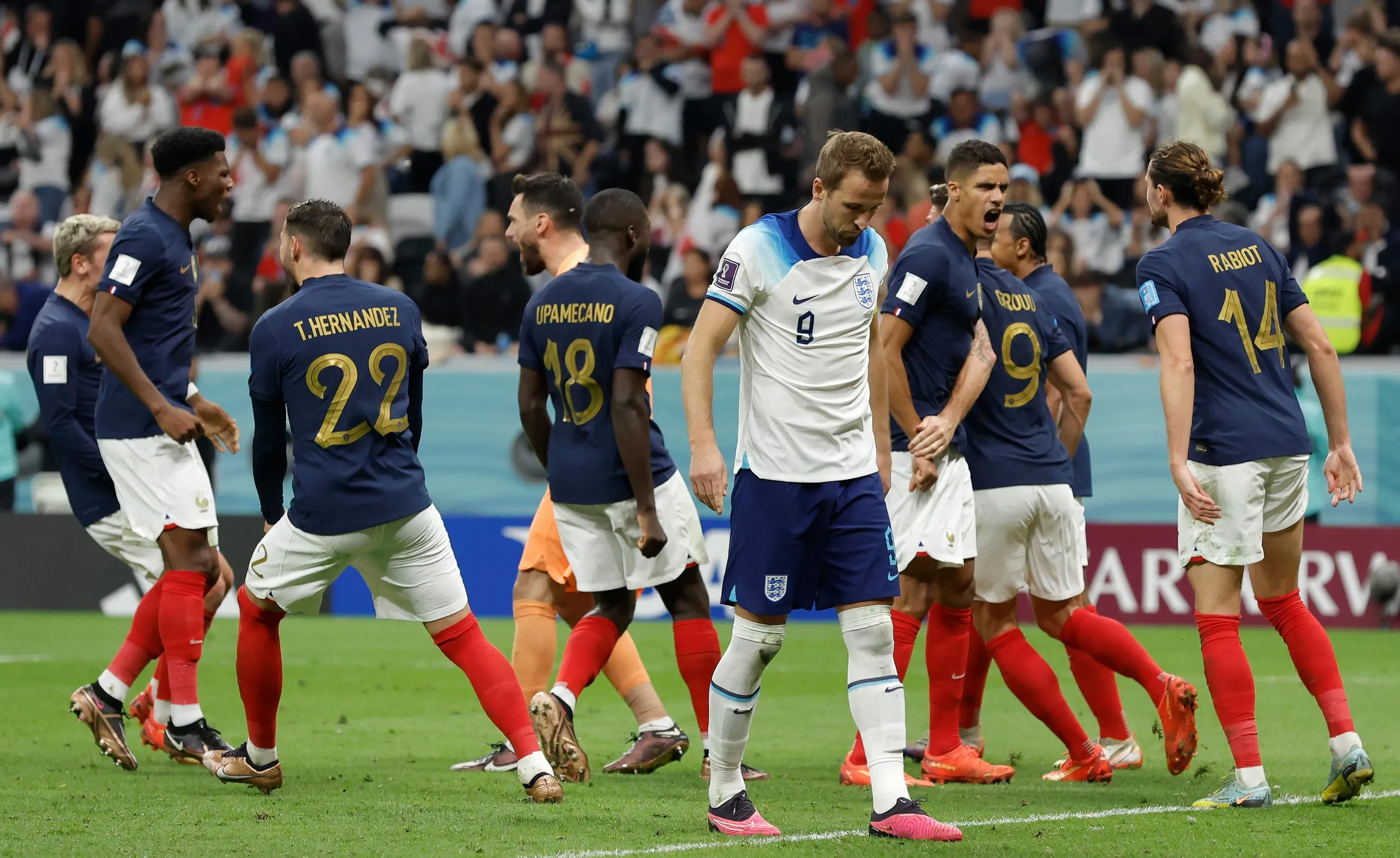France players celebrate while Harry Kane is downcast after missing a penalty in England’s 2022 World Cup quarter-final in Qatar