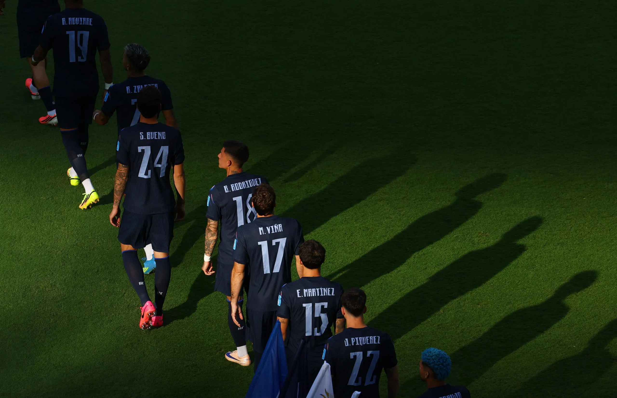 Uruguay players walk out before the start of the match