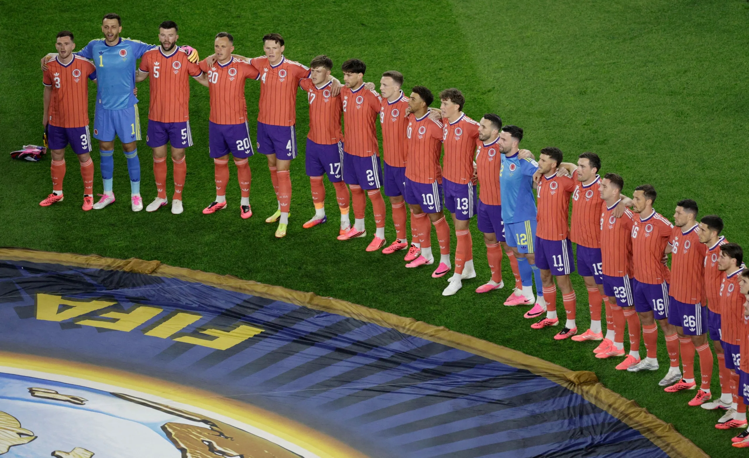 Scotland players line up during the national anthems before the match