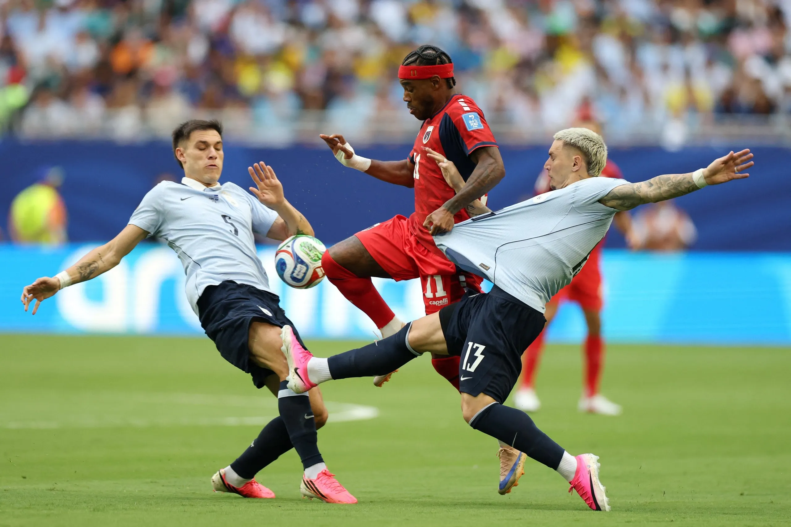 Manuel Ugarte and Guillermo Varela battle for the ball with Cape Verde’s Garry Rodrigues