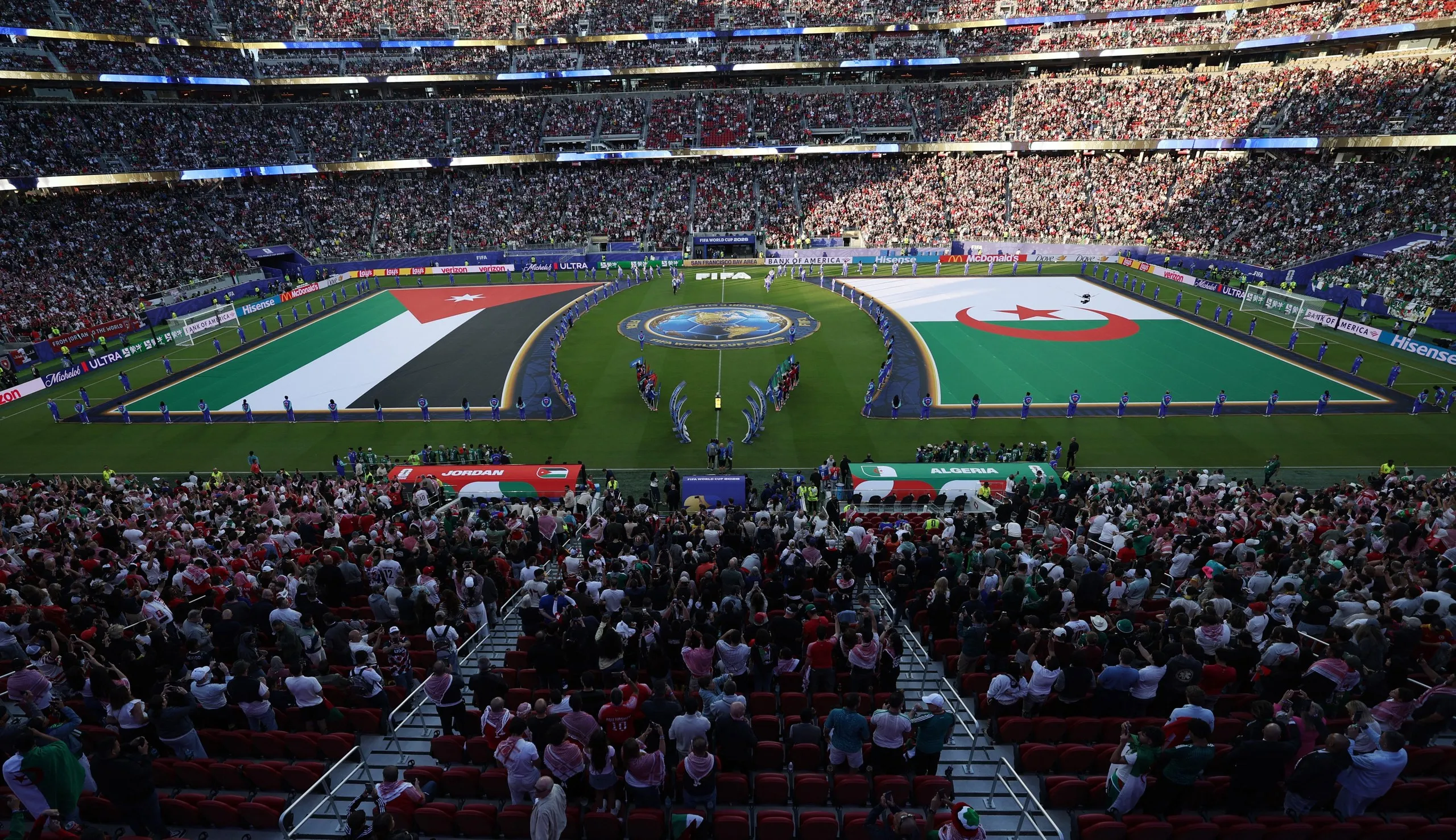 General view of large Jordan and Algeria flags inside the stadium before the match