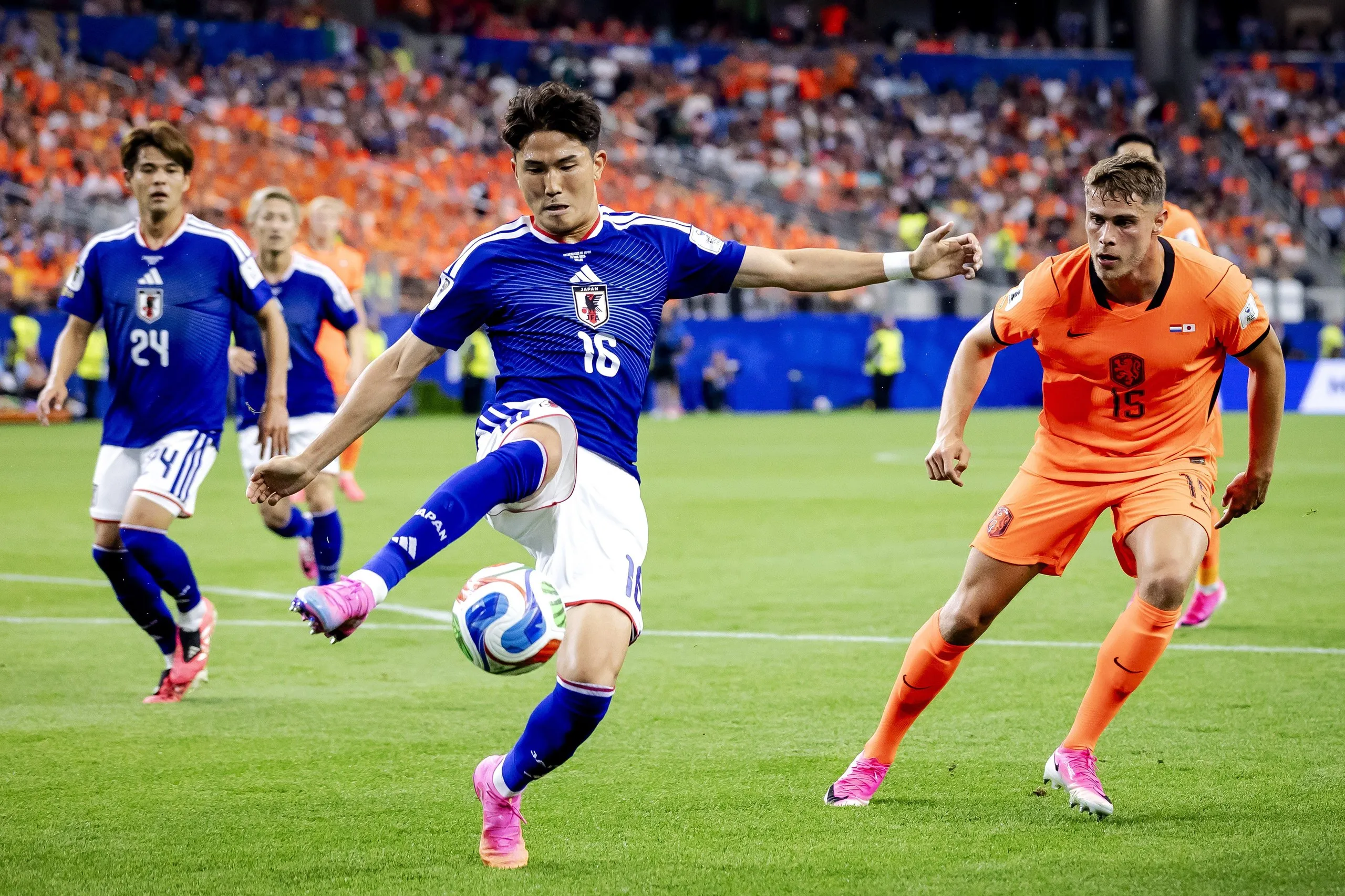 Kaishu Sano of Japan, Tsuyoshi Watanabe of Japan and Micky of the Ven of the Netherlands during the 2026 FIFA World Cup Group F match between the Netherlands and Japan