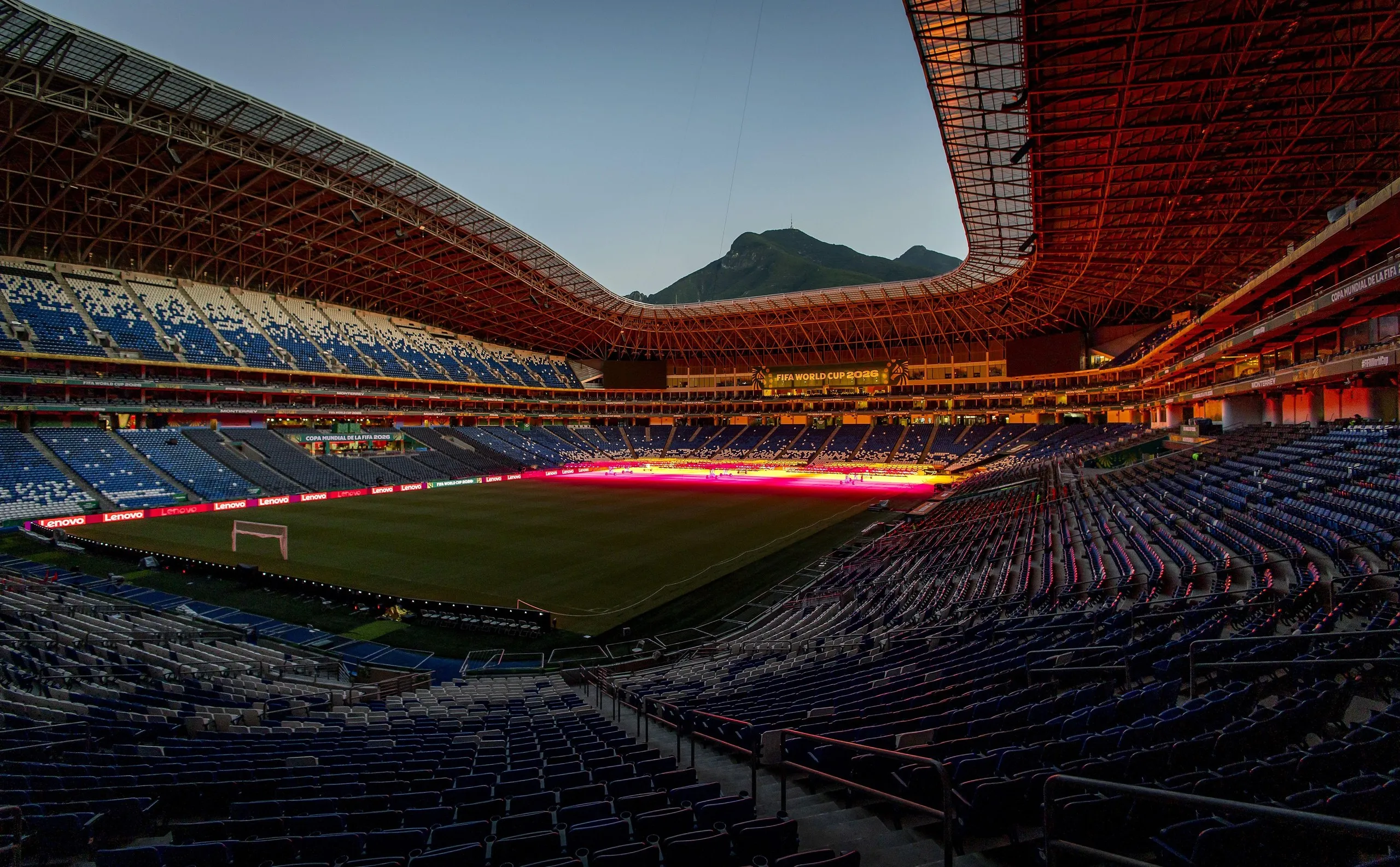 View of Monterrey stadium with a view of a mountain in the background. 