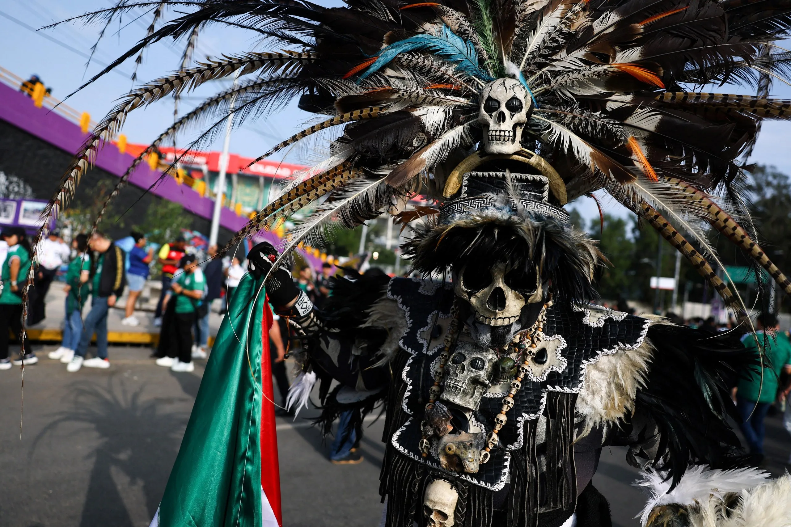 A Mexico fan poses for a photograph