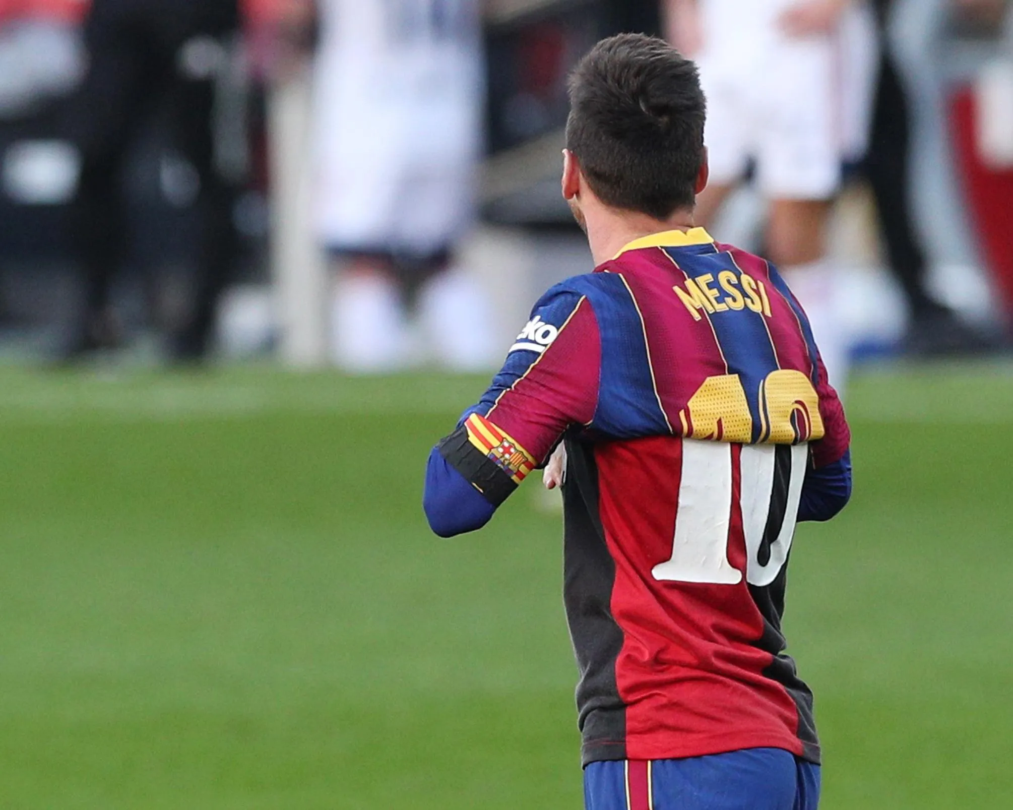 Lionel Messi, then playing for Barcelona, wears a Maradona 10 Newell’s Old Boys shirt under his own Messi 10 Barcelona shirt as a tribute to Diego Maradona who had recently died.