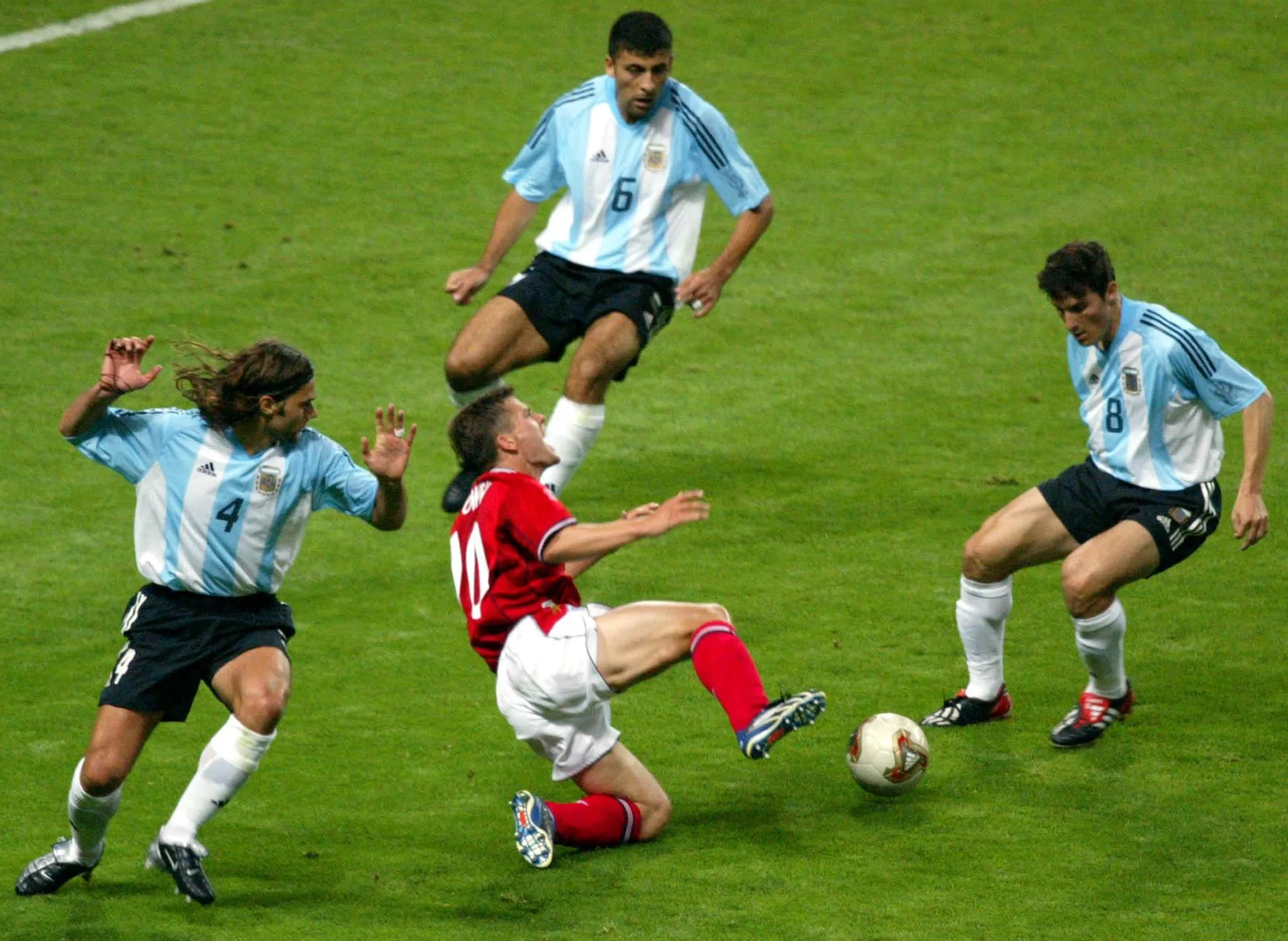 Michael Owen is fouled in the box by Mauricio Pochettino (left) in Japan in 2002.