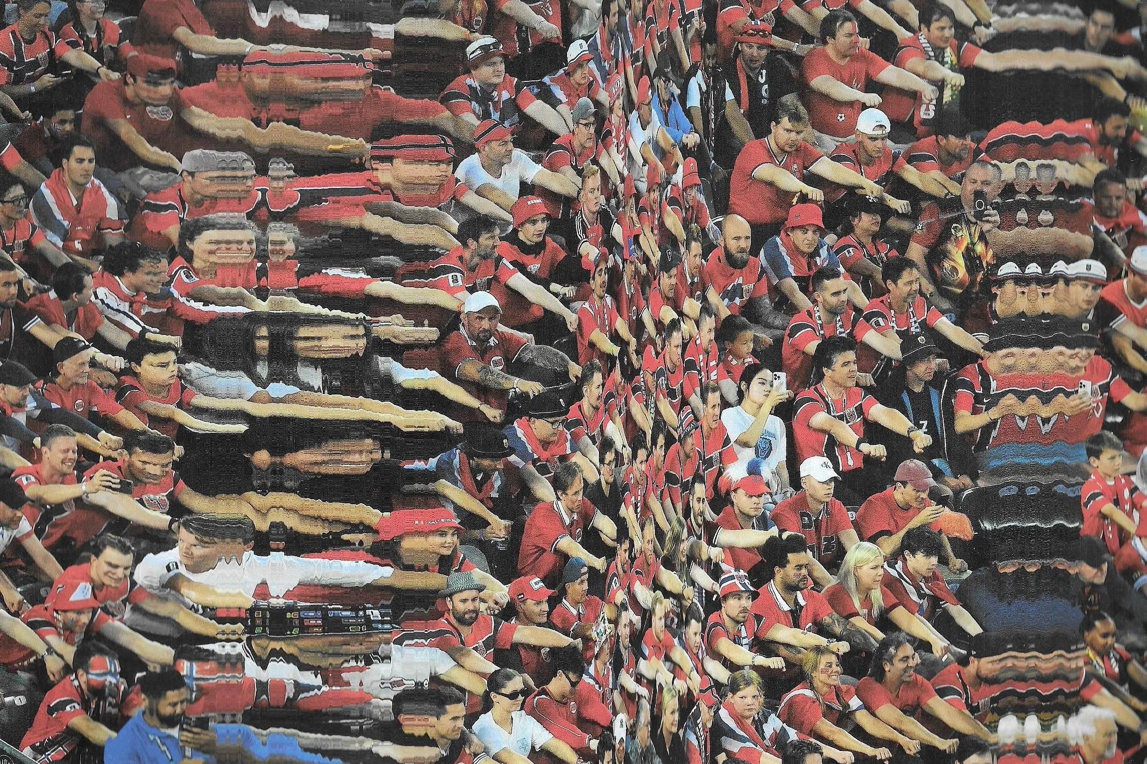 Norway fans rowing an imaginary Viking boat. Photograph: Original photograph by Timothy A Clary.