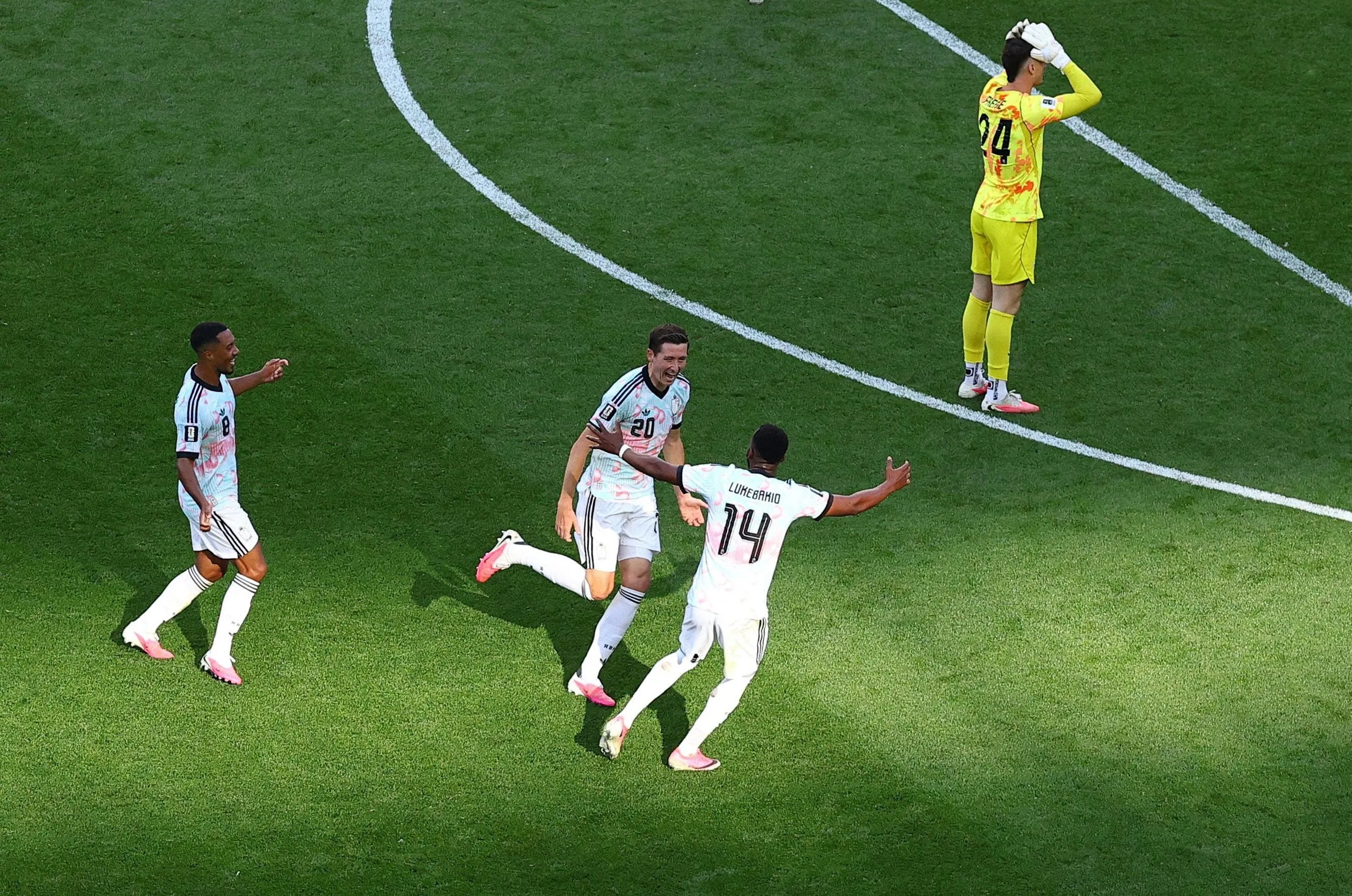Belgium’s Hans Vanaken runs to celebrate after capitalizing off Matt Freese’s goalkeeping error.