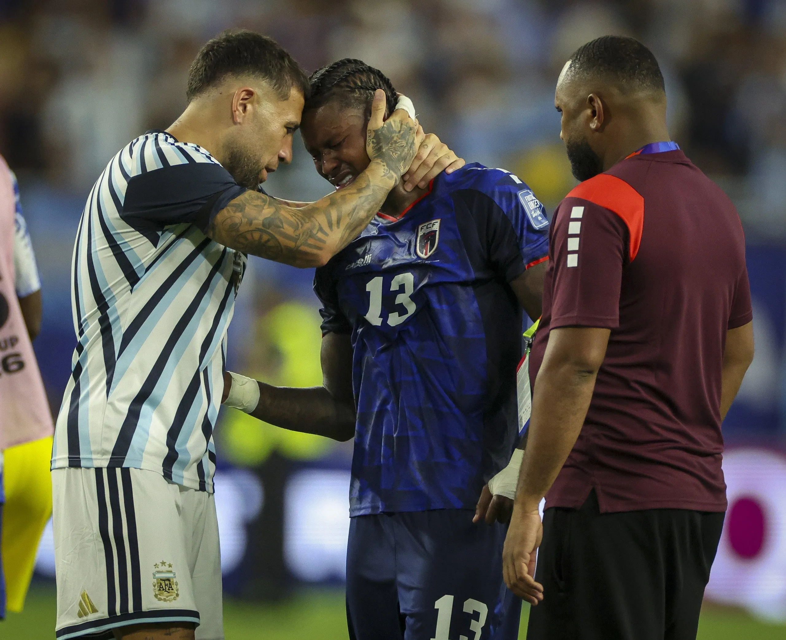 Cape Verde’s Sidny Lopes Cabral is comforted by Nicolás Otamendi after Argentina squeezed through in their last-32 tie.