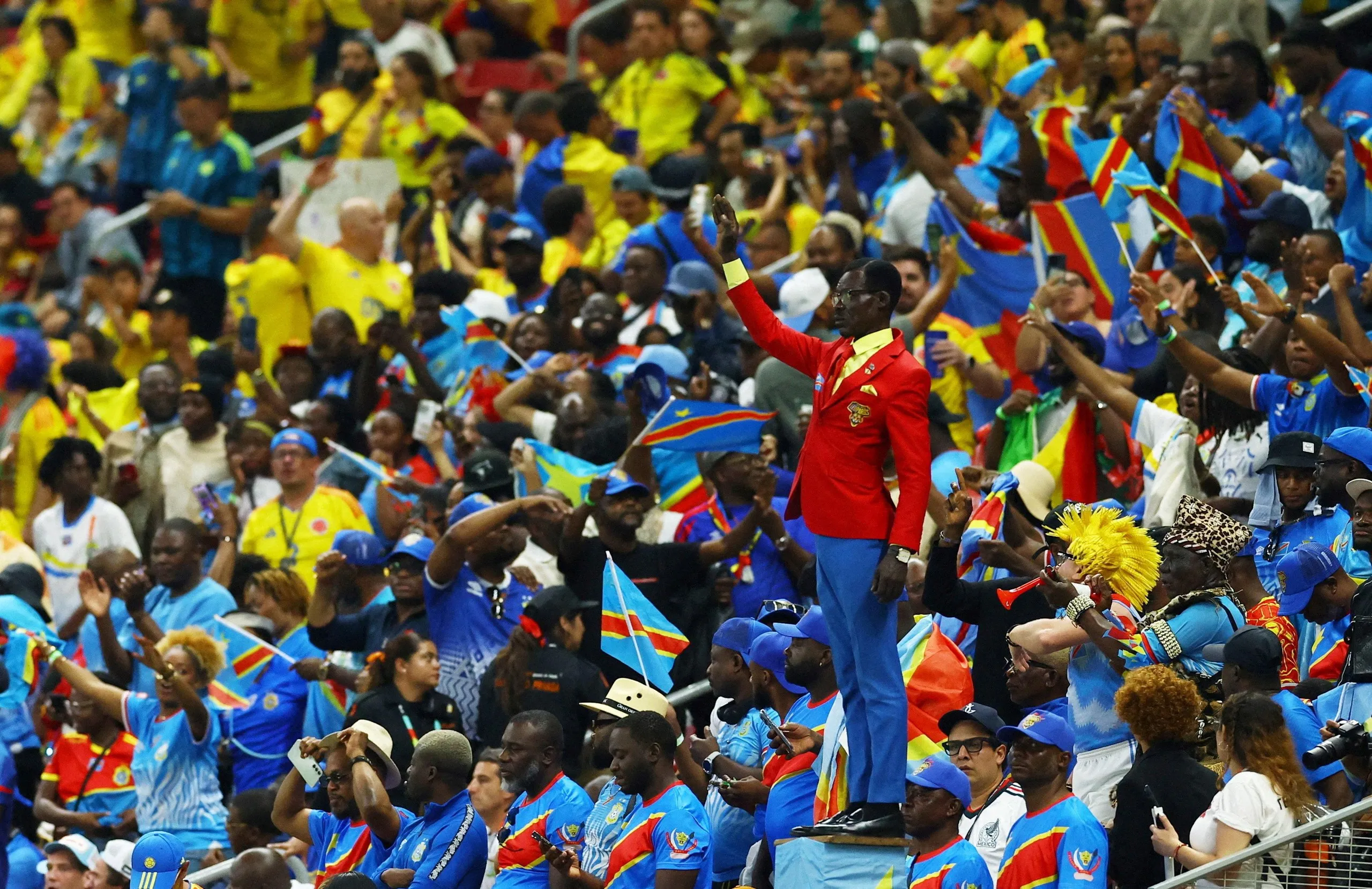 Michel Nkuka Mboladinga, also known as Lumumba Vea, performs as a statue in the stands during their match against Colombia.