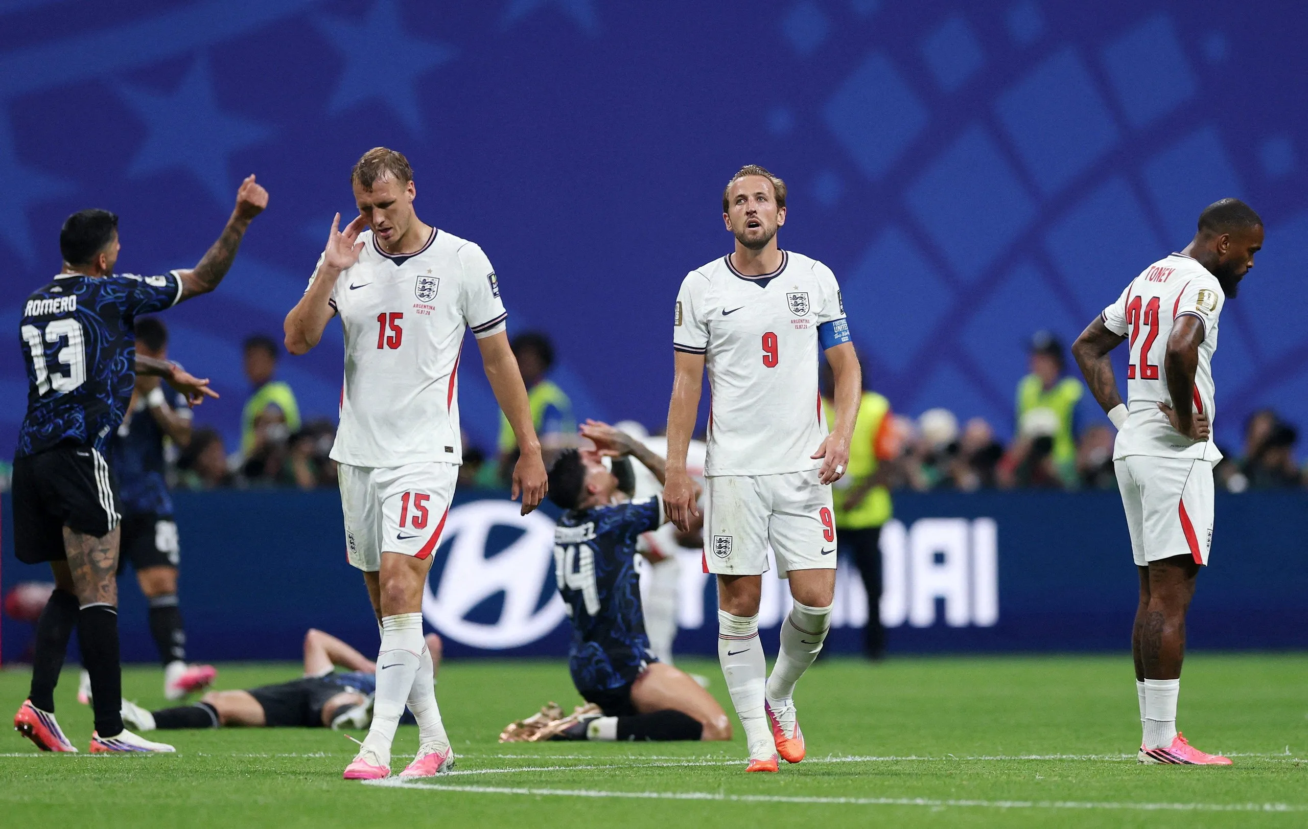 England players look dejected after the semi-final defeat by Argentina