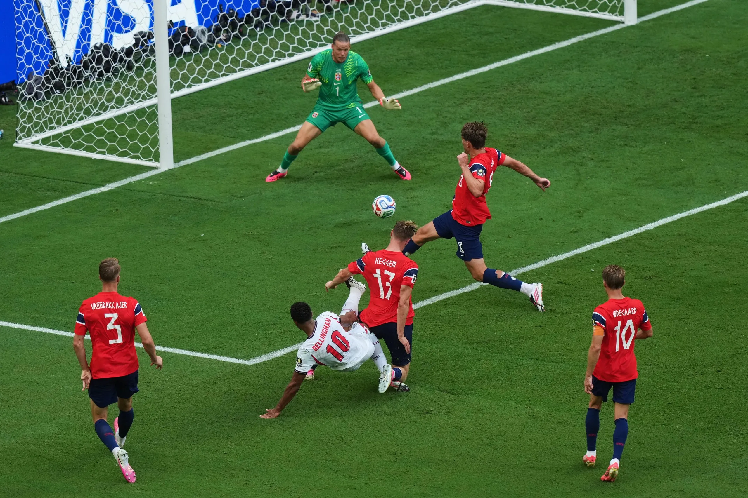 Jude Bellingham holds off the challenge of Torbjørn Heggem to score the first of his two goals in Miami