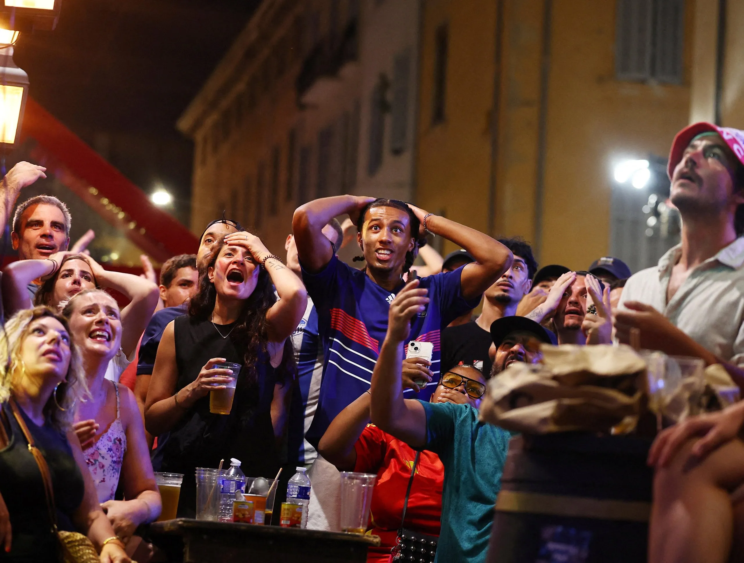 Fans watch the World Cup semi-final match between France and Spain in the Old Port of Marseille