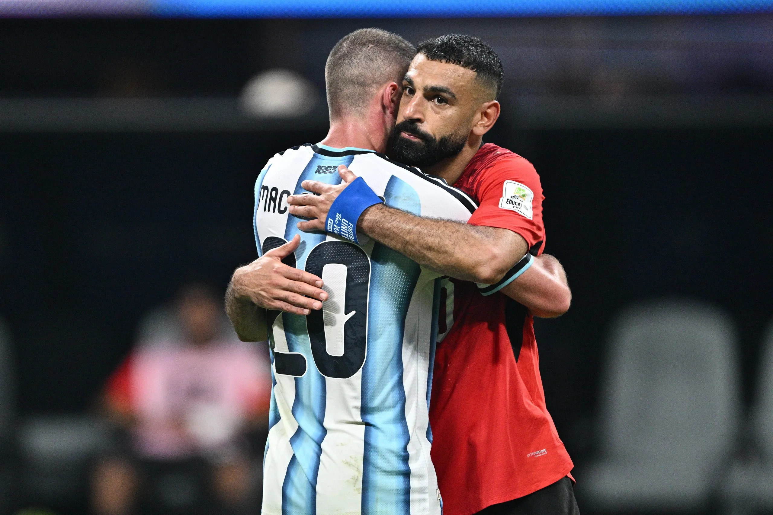 Mohamed Salah hugs his former Liverpool teammate Alexis Mac Allister after Argentina’s victory